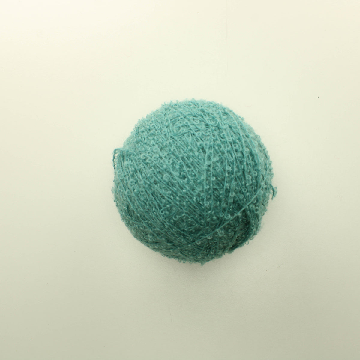 Murrettu turkoosi villasekoitelanka boucle (250g)