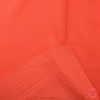 Oranssi neulosmainen pintakuvioitu kangas - Pala
